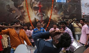 Fans of Rajinikanth outside a cinema in Hyderabad, India