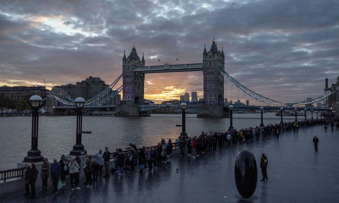 People queue near Tower Bridge to pay their respects.