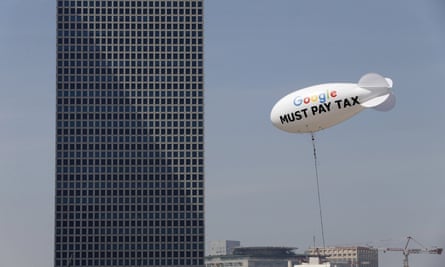 Blimp reading “Google must pay tax” floating over the Tel Aviv skyline