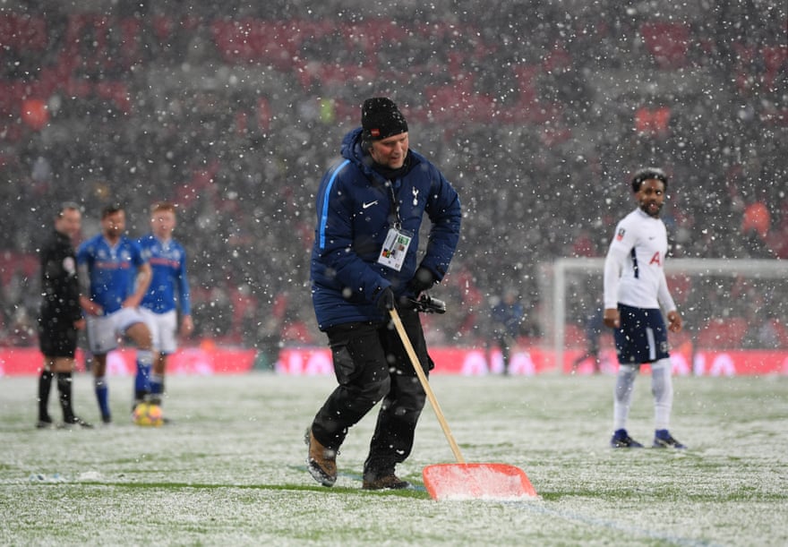 Clearing snow from the pitch during Tottenham Hotspur v Rochdale at Wembley stadium in February 2018.