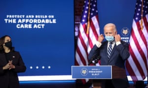 Biden gets ready to speak in Wilmington, Delaware, moments ago, after being introduced by his running mate and vice president-elect Kamala Harris.