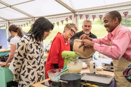 Leith, Hollywood and co-presenter Noel Fielding watch Peter Abatan at work in series eight of Bake Off
