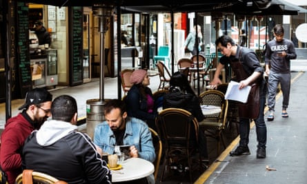 Customers sit outside at a cafe in Melbourne’s Degraves Street
