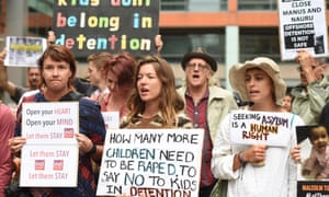 Hundreds of protesters hold a rally outside the Department of Immigration offices in Sydney to call for the closure of the Nauru and Manus detention centres.