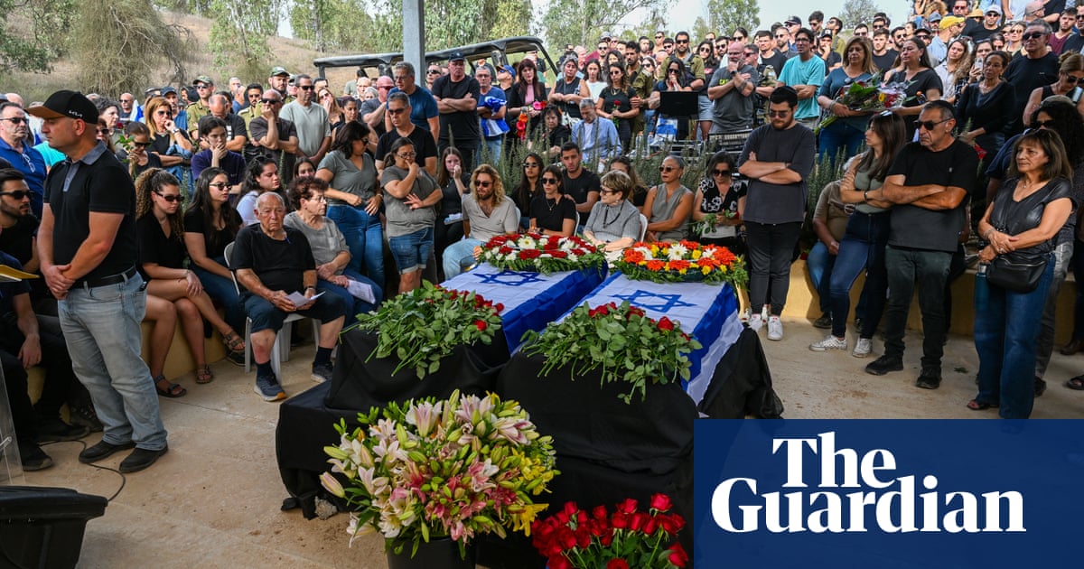 ‘They were abandoned’: grief and anger at funeral for Hamas kibbutz victims