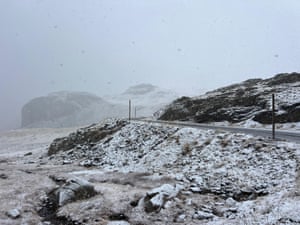 A snowy hillside with a misty atmosphere