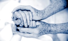 Holding hands of an elderly person