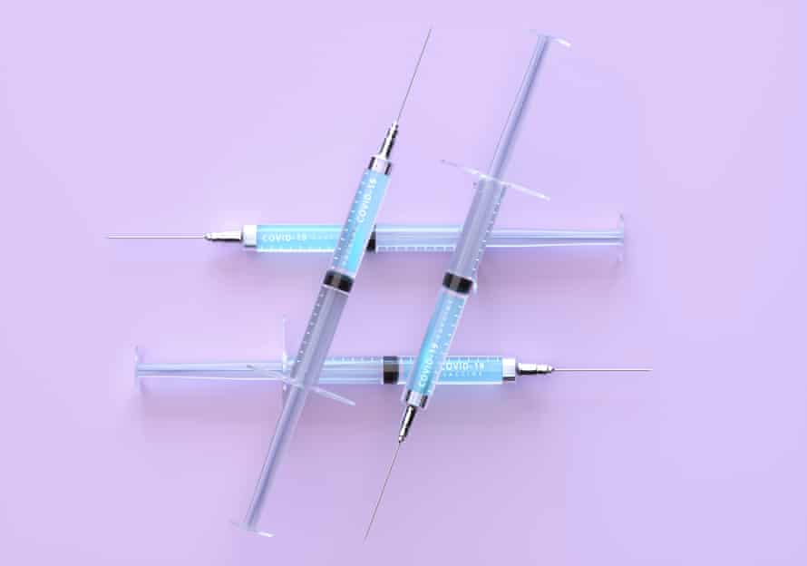 Syringes on a pink surface making a hash symbol