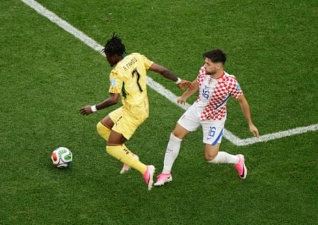 Abdul Fatawu nips past Martin Baturina to get a cross in for Ghana.