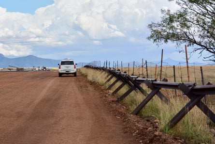 The new wall will replace low barriers meant to stop vehicles but which still allow wildlife to get across.