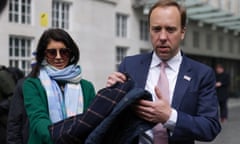 Britain’s Health Secretary Hancock hands his coat to aide Coladangelo before television interview in London<br>Britain’s Health Secretary Matt Hancock hands his coat to his aide Gina Coladangelo (L) before a television interview outside BBC’s Broadcasting House in London, Britain, May 16, 2021. Picture taken May 16, 2021. REUTERS/Tom Nicholson