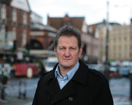 Jon Sparkes on street looking at camera
