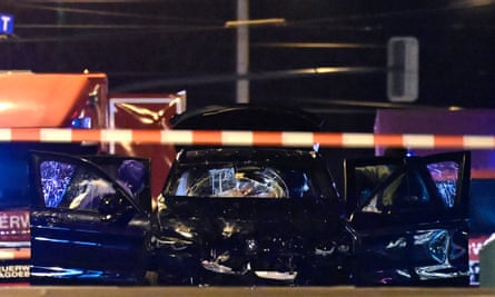 Forensics police inspect the car that crashed into a crowd at a Christmas market in Magdeburg.