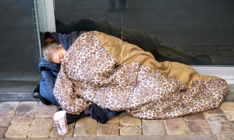 A homeless woman sleeps rough in Manchester