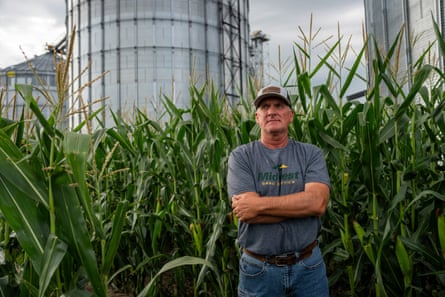 a man stands on a farm