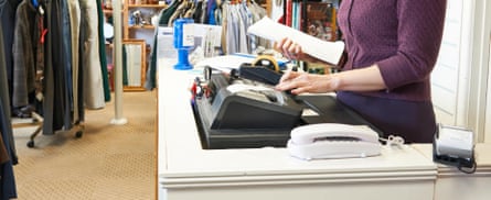 A volunteer working in a charity shop