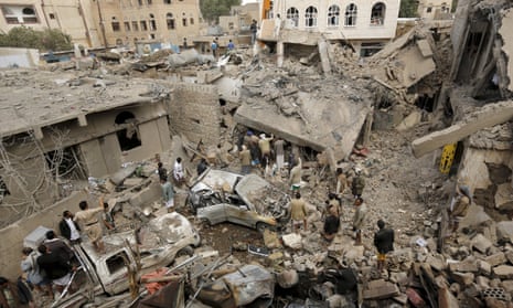 People at the site of a Saudi-led airstrike in Yemen’s capital Sana’a. 