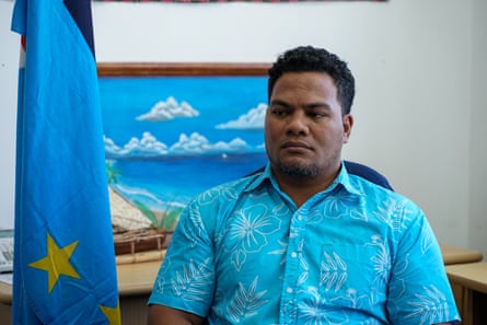 Simon Kofe sits in his office in the government building in Funafuti.