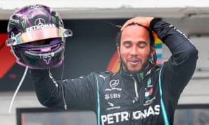 Lewis Hamilton celebrates after winning the Hungarian Grand Prix for a record eighth time.