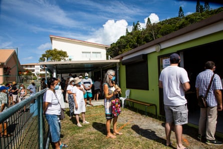 Long queues of people waiting to vote in New Caledonia’s independence referendum in south Nouméa