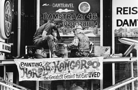 Thornton paints in a window in the Damstraat, Amsterdam in 1980.