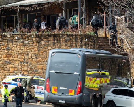 Passengers who arrived on a bus unload their baggage and enter the Feathertop Winery operations centre, just west of Porepunkah