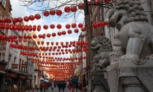 People walk through Chinatown on 12 February n London. This year’s festivities, which usher in the Year of the Ox, take place while the UK remains in lockdown