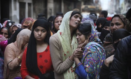 Relatives mourn Mohammad Mudasir, 31, who was killed in rioting in Delhi