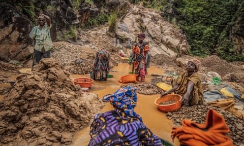 Women pan for gold in Kamituga, in eastern Congo’s South Kivu province