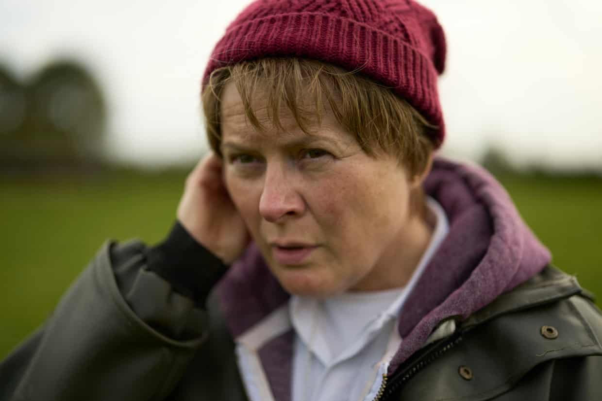 Dolan as Corless, wearing a wool hat and coat and hoodie, in a scene from The Lost Children of Tuam.