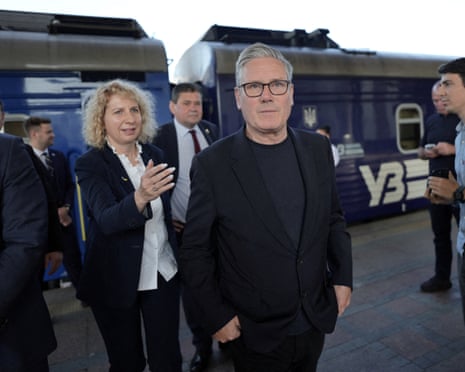 British prime minister Keir Starmer is welcomed by Ukrainian officials at the train station in Kyiv, as he visits Ukraine for the last time before leaving office.