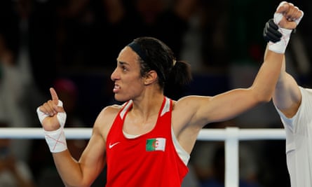 Imane Khelif celebrates after being announced as the winner of her gold medal match in Paris