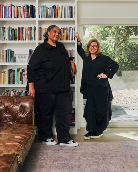 Author Roxane Gay with her wife Debbie Millman, designer and host of the podcast Design Matters, in the library at their home.