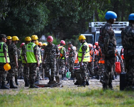 Nepali army members prepare to leave on rescue missions in Nepal's Nuwakot district on Friday