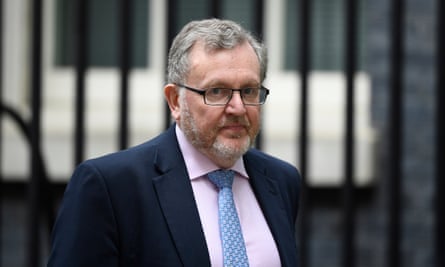 David Mundell photographed walking along a street