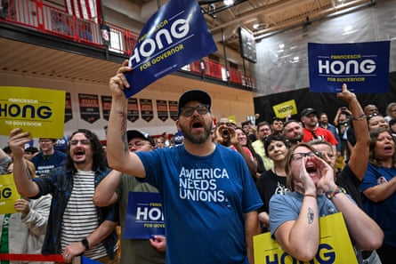 people holding signs saying ‘francesca hong for governor’ at rally