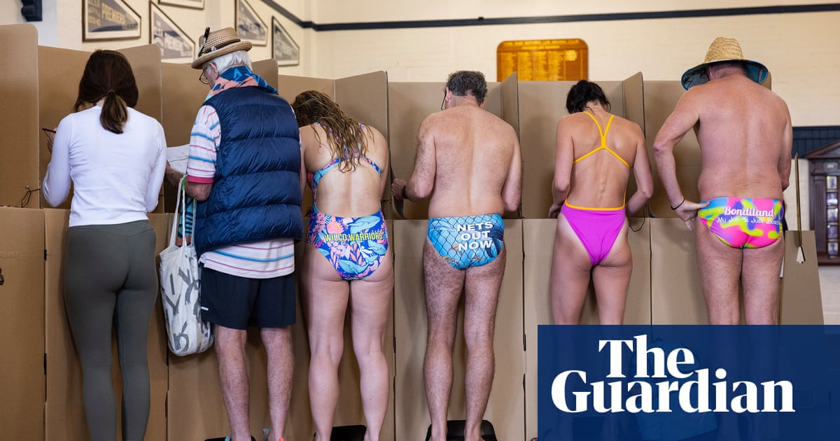 Swimmers, dogs and democracy sausages: Australian election day  in pictures
