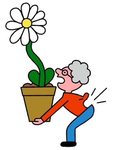 Woman having back pain from lifting plant pot