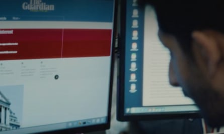 A man looks at a computer screen