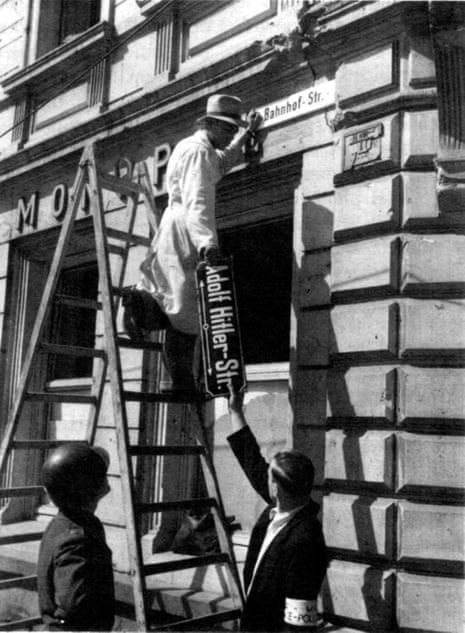 A Nazi-era street sign is removed in Trier, Germany, days after the end of the second world war