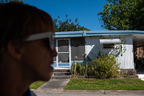‘It’s hell’: life under the American mobile home king who calls himself a ‘grave dancer’ Nicholas Hallock rides around Down Yonder in his golf cart.