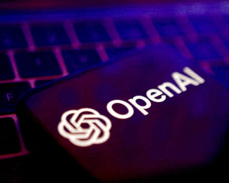 OpenAI logo on a device placed on a keyboard