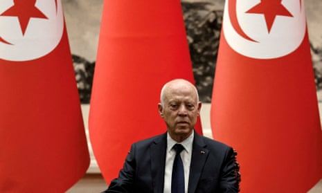 Tunisian President Kais Saied stood in front of Turkish flags