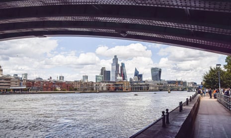 A view of the City of London skyline and Thames beneath Blackfriars bridge
