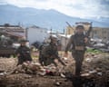 IDF soldiers with blurred faces walking on rubble in Lebanon