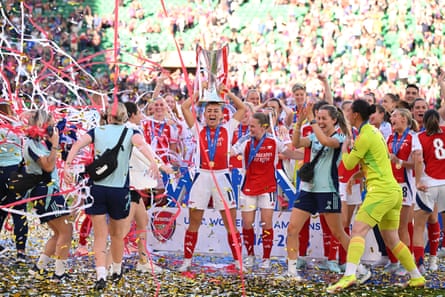 Katie McCabe lifts the trophy after her team’s victory in the Women’s Champions League final match between Arsenal and Barcelona
