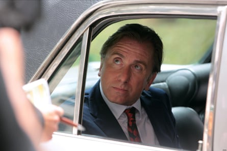Tim Roth in a car in the film United Passions