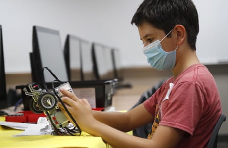 Sixth-grader Salih Tas builds a robot at a summer camp in Wylie, Texas.