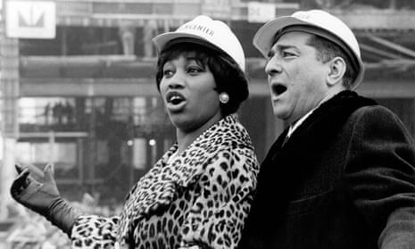 Soprano Leontyne Price and baritone Robert Merrill duet at the construction site of the new Metropolitan Opera House in 1964.