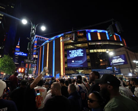 Basketball fans gather outside Madison Square Garden during Game 1 of the NBA Finals between the New York Knicks and the San Antonio Spurs on 3 June.